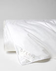 A hypoallergenic microfiber fills SFERRA's Arcadia down alternative duvet.