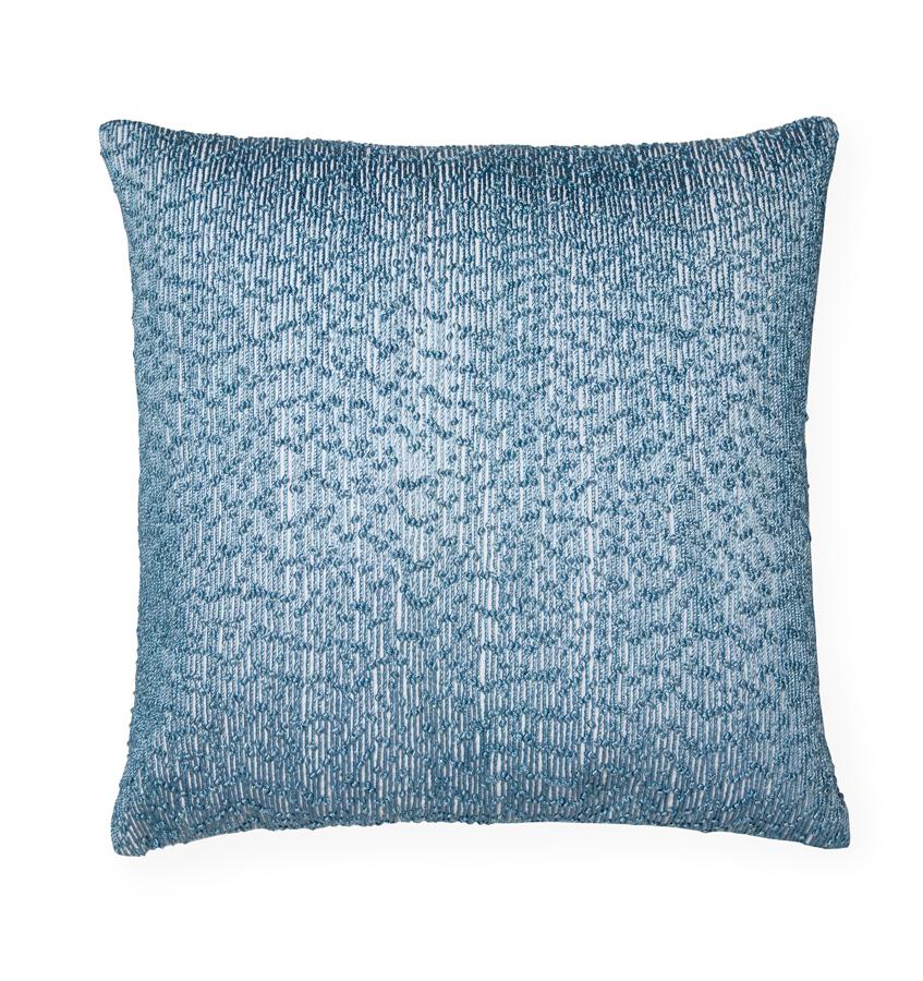Lesina  decorative  pillow  features  embroidered  threads  woven on a crisp white cotton-linen base. 