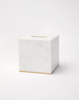Gold-trimmed white marble tissue holder against a white background.