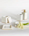 Gold-trimmed white marble SFERRA bath accessories against a white background.