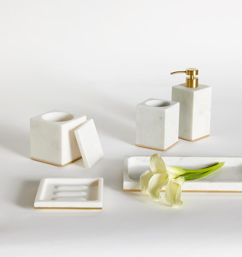 Gold-trimmed white marble SFERRA bath accessories against a white background.