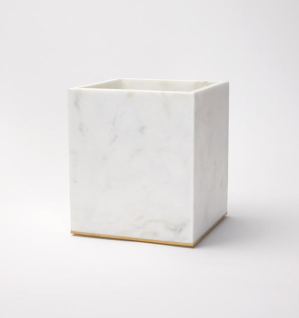 Gold-trimmed marble waste basket against a white background.