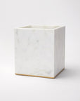 Gold-trimmed marble waste basket against a white background.