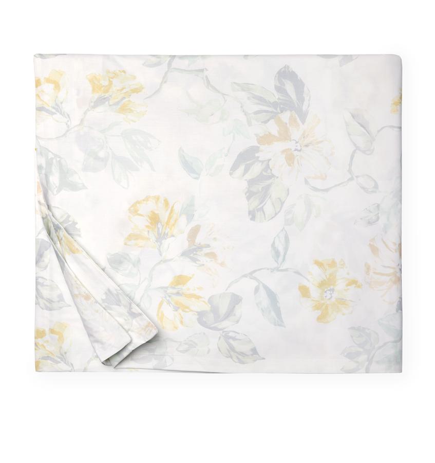 Silhouette image of a white cotton percale duvet cover with a light yellow floral motif against a white background.