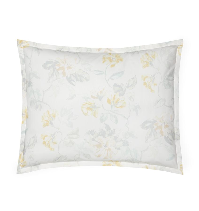 White cotton percale sham with a light yellow floral motif against a white background.