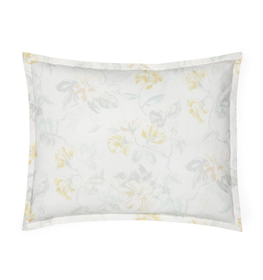 White cotton percale sham with a light yellow floral motif against a white background.