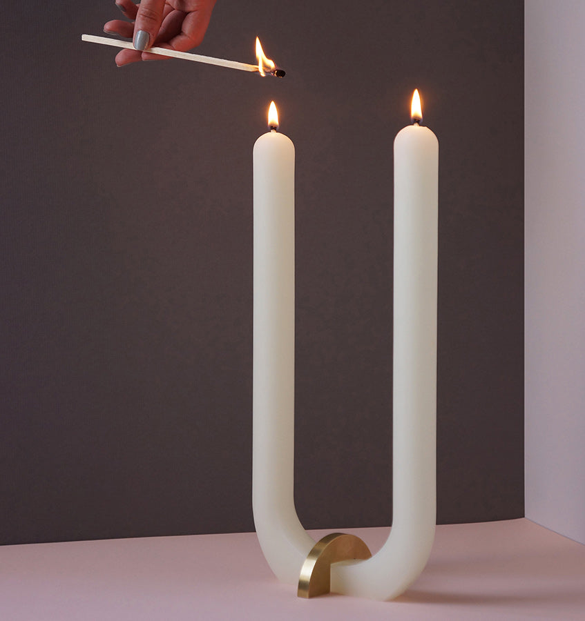  U Candle by Glaze Studio is a hand-poured, dual burning candle made of 100% white beeswax, sold by SFERRA.