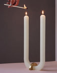  U Candle by Glaze Studio is a hand-poured, dual burning candle made of 100% white beeswax, sold by SFERRA.