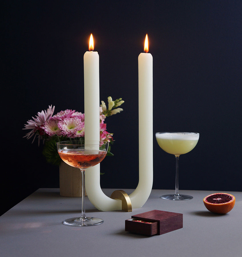  U Candle by Glaze Studio is a hand-poured, dual burning candle made of 100% white beeswax, sold by SFERRA.