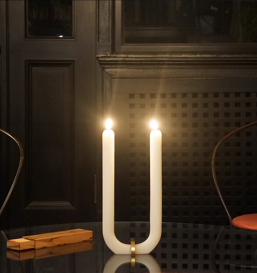  U Candle by Glaze Studio is a hand-poured, dual burning candle made of 100% white beeswax, sold by SFERRA.