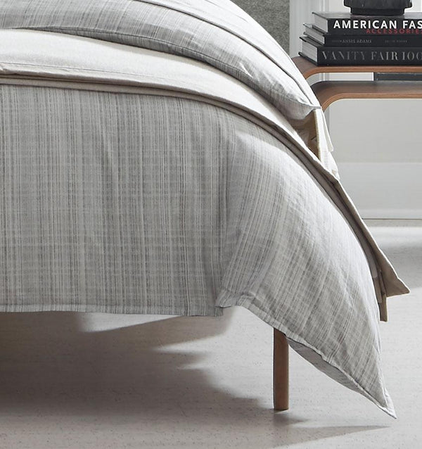 Borsetto Duvet Cover is woven from a yarn-dyed, sateen jacquard with a minimalist tartan motif. 