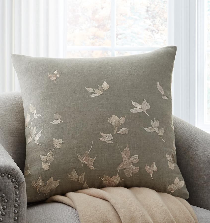 SFERRA Miada Decorative Pillow resembles hand-painted petals, giving the design a sense of delicacy, while the Olive linen base and solid back lend it an earthy feel.