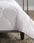 A hypoallergenic microfiber fills SFERRA's Arcadia down alternative duvet.