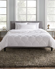 A hypoallergenic microfiber fills SFERRA's Arcadia down alternative duvet.