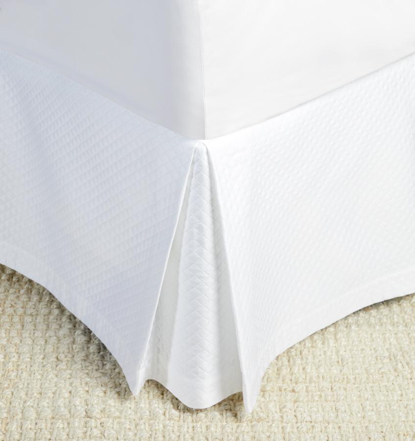 A luxury SFERRA bed skirt with a diamond piqué pattern. The Bari Collection is available in an array of pastel colors.