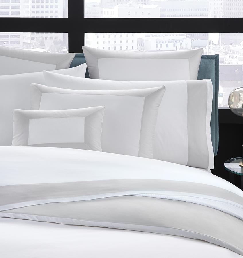 Casida Duvet Cover is minimal with its contrast color border in sateen appliqué along one side, and solid sateen on the reverse.