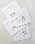 SFERRA Cheers cocktail napkins feature a cheerful selection of four drinks on hemstitched linen napkins.