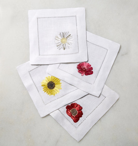 SFERRA Fiori cocktail napkins feature floral embroidery of the most cheerful blossoms on white hemstitched linen napkin.