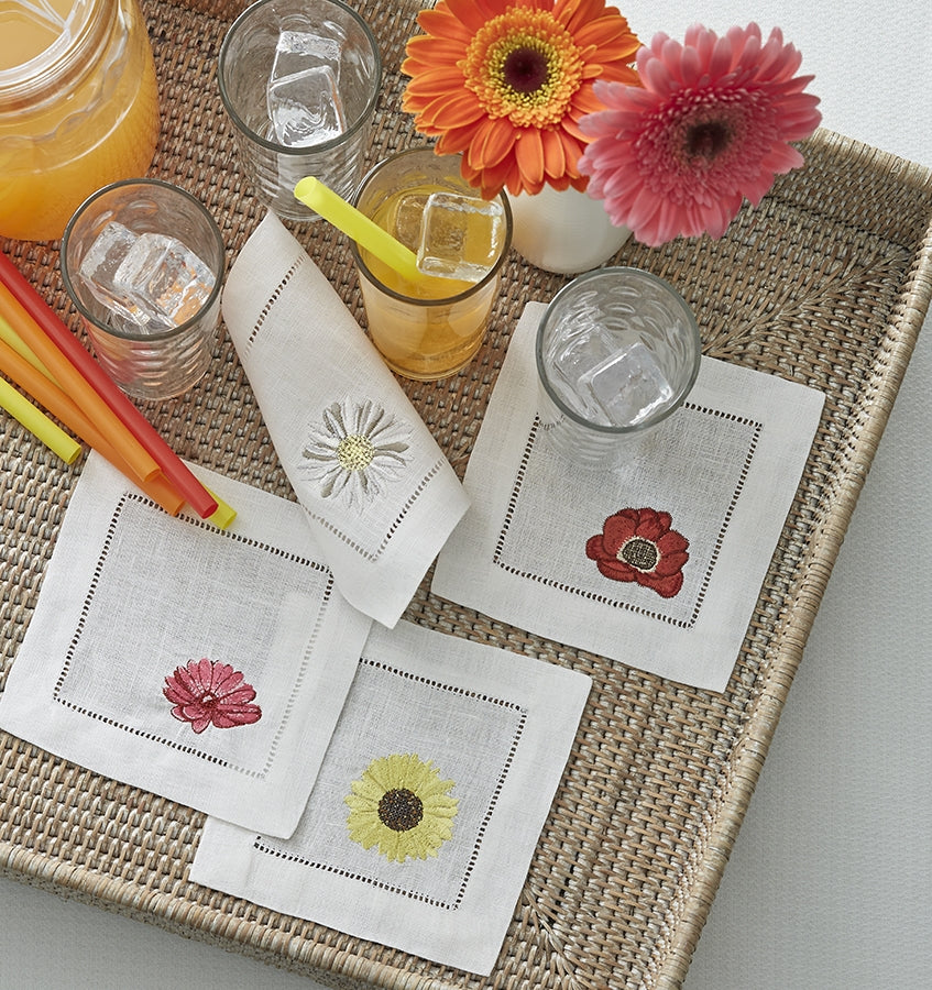 SFERRA Fiori cocktail napkins feature floral embroidery of the most cheerful blossoms on white hemstitched linen napkin.