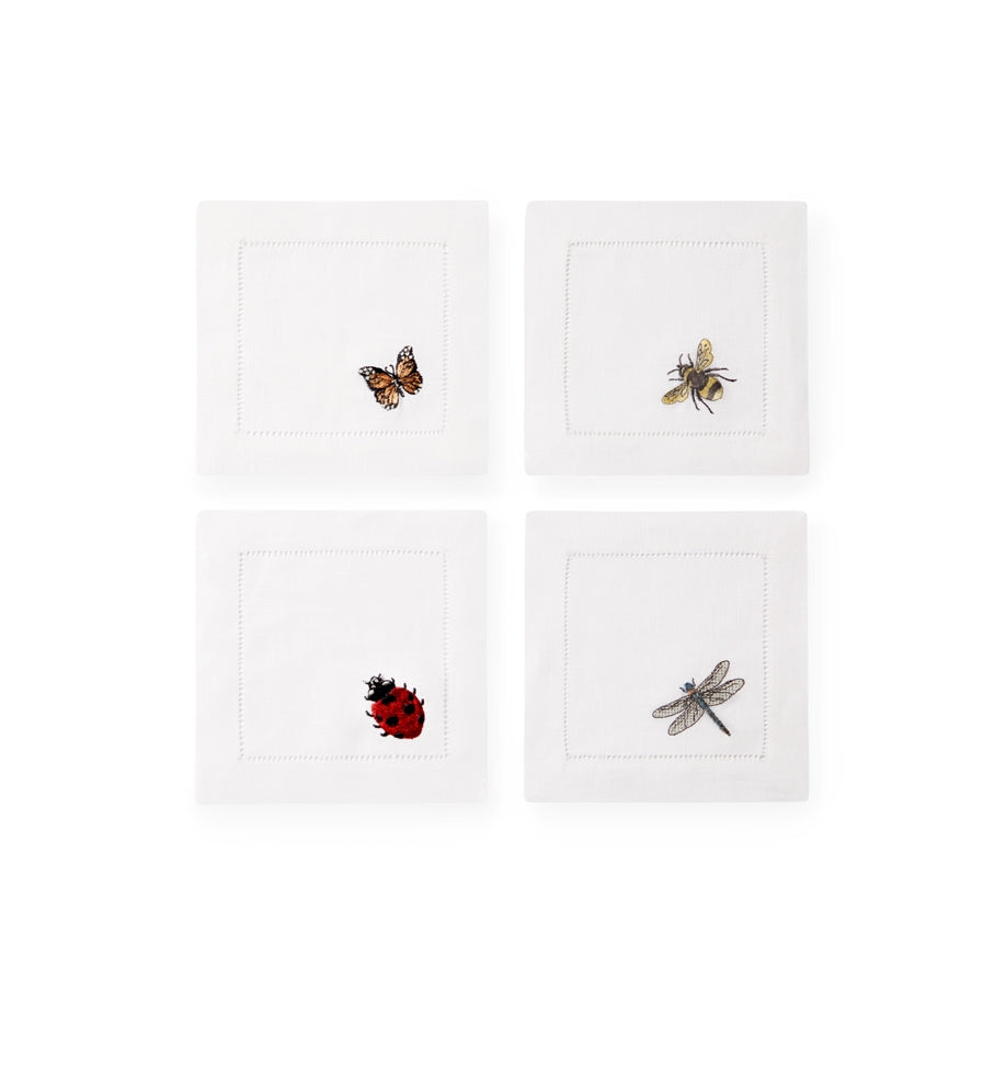 SFERRA Insetti cocktail napkins feature endearing insects on white hemstitched linen napkins.