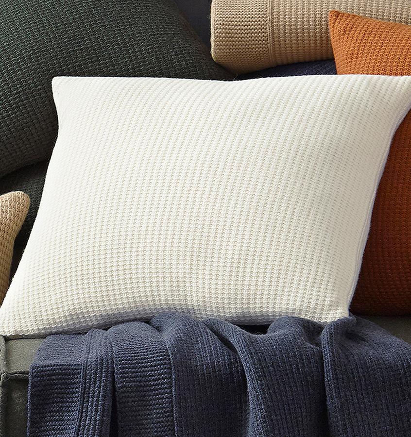 In a chunky lambswool knit, our Pettra decorative pillow is more than a welcoming spot to rest-it's an invitation to daydream in the comfort of its warmth.