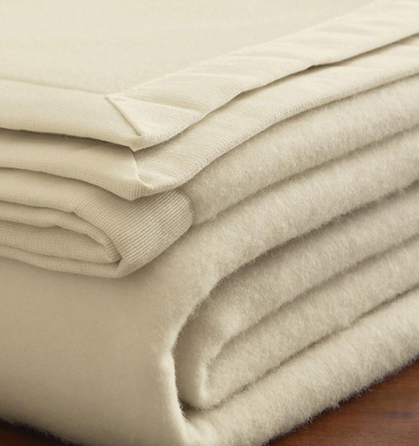 The luxury SFERRA Savoy Blanket, a pure cashmere ivory blanket. 
