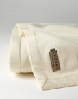 The luxury SFERRA Savoy Blanket, a pure cashmere ivory blanket. 