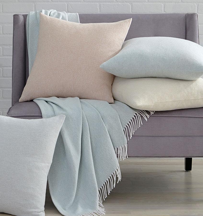 Terzo pillows and throws feature a classic basket weave pattern in soft, versatile colors.