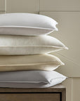 A stack of shams covered with SFERRA Tesoro luxury bedding, crafted from the finest cotton in the world.