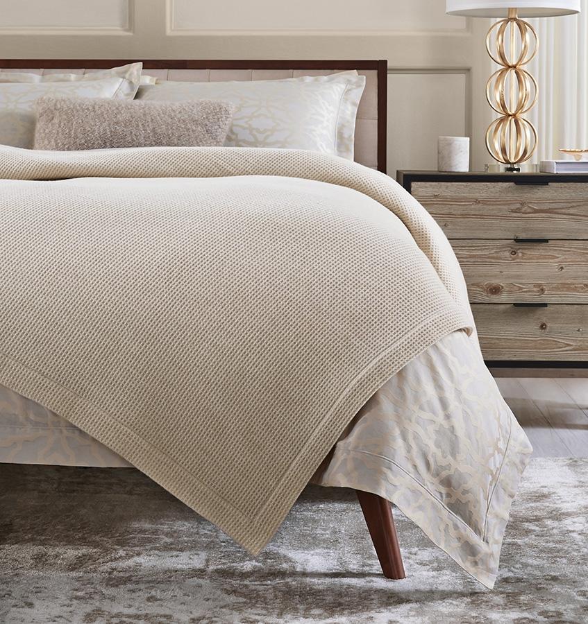 The SFERRA Talida Blanket, a traditional waffle weave with two tonal shades. It is woven with the finest Merino wool.